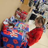 Ivy preparing her Poppy stand