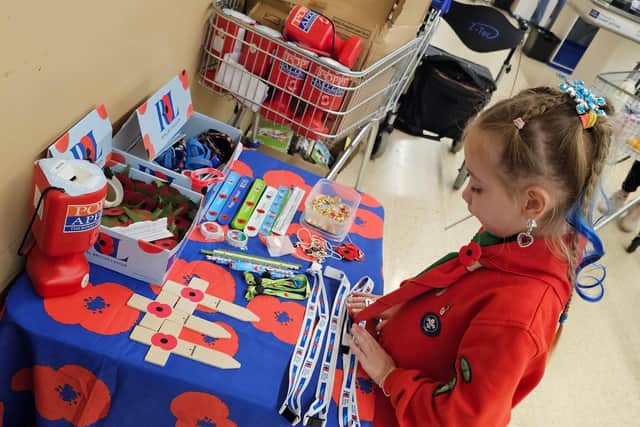 Ivy preparing her Poppy stand