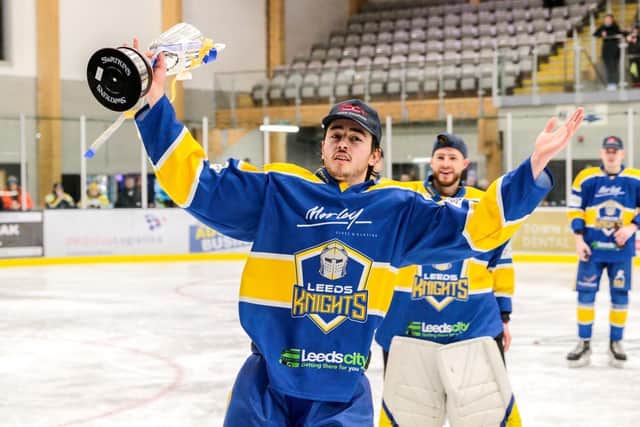 Bailey Perre celebrates winning the NIHL National league title