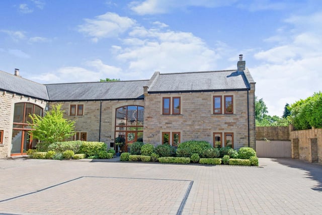 The Manor Court property has a private driveway and a shared courtyard frontage.