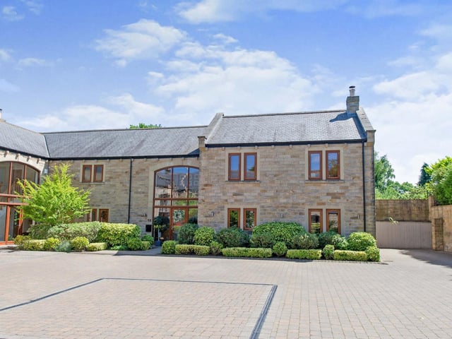 The Manor Court property has a private driveway and a shared courtyard frontage.