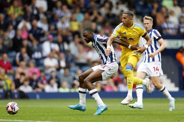 'NO SERVICE': For Leeds United striker Mateo Joseph, centre, in Saturday's goalless draw at Championship hosts West Brom, the Whites forward pictured in battle with Baggies defender Semi Ajayi. Photo by Nigel French/PA Wire.