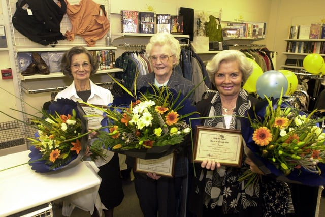 Help the Aged volunteers are presented with years of service awards, at the shop in Street Lane, Roundhay, in 2002. Pictured from the left is Alison Pearson, Joan Dalley and Marie Barnes. Picture: Dan Oxtoby.