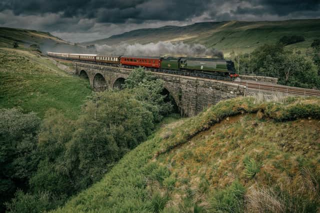 Letting off steam ... the Northern Belle thunders over the Settle-Carlisle line
