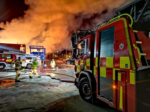 The number of appliances at the scene have been reduced but the fire continues to burn.