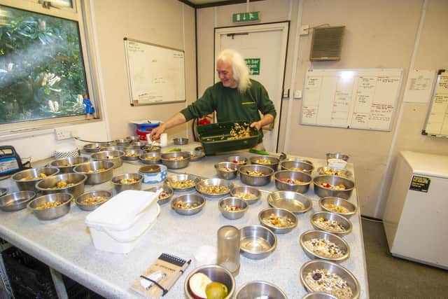 Bird keeper Peter Stubbs preparing the food for the 300 birds kept at the bird garden at Harewood House