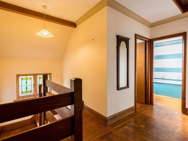 To the first floor, this charming house continues to impress with a landing with oak flooring leading to three large, double bedrooms, all with glorious views and cedarwood flooring.