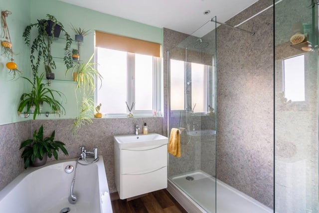The house bathroom is ideal for family life, with a large walk-in shower for a quick refresh and a bath for a long, luxurious soak after a busy day.
