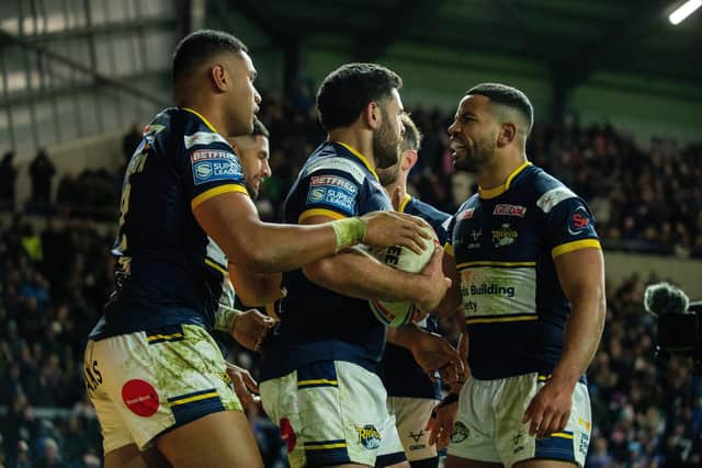 David Fusitu'a , left, celebrates scoring the Rhinos' third try against Hull. Picture by Bruce Rollinson.