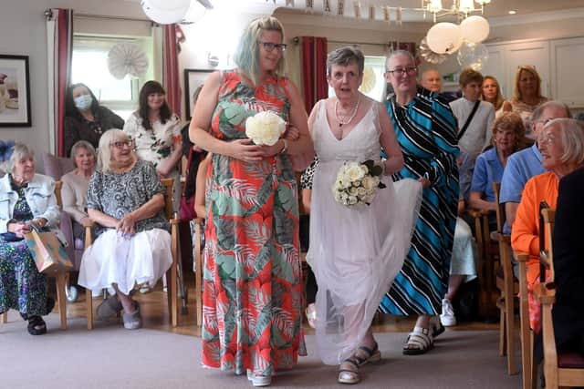 Jacqui Stevenson, 76, was walked down the aisle at Beech Hall Care Home, in Armley, Leeds, in front of an audience of all of the care home residents on September 26. Photo: Simon Hulme.