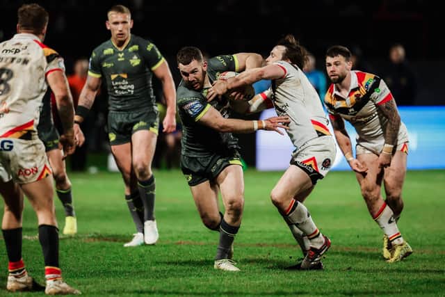 Cameron Smith, seen being tackled by Joe Mellor of Bradford Bulls, had a strong game off he bench in the Good Friday victory at Odsal. Picture by Alex Whitehead/SWpix.com.