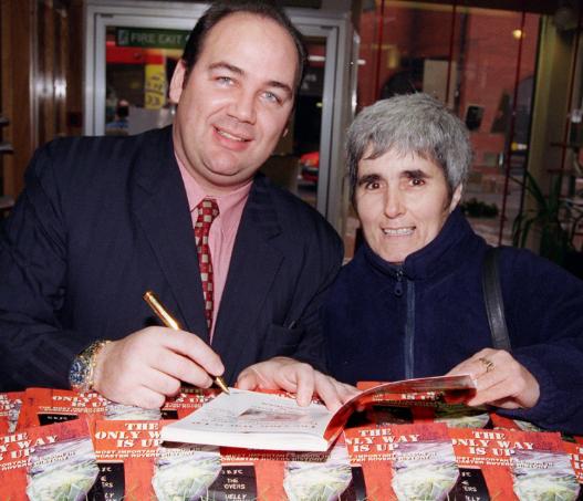 Doncaster Rovers Cheif Executive Ian McMahon signs a copy of his book in 1999.