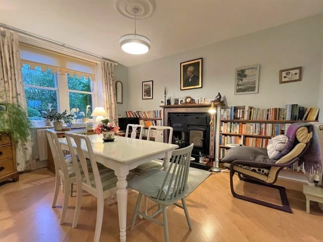 The well-lit dining room displays a traditional range.