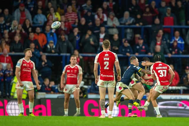 Hull KR's Brad Schneider kicks the extra-time winning drop goal, after Rhinos failed to manage a single attempt at a one-pointer. Picture by Bruce Rollinson