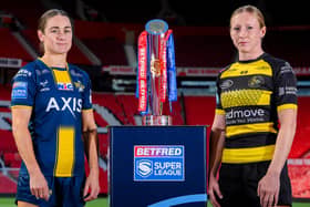 Leeds Rhinos' Mel Howard and Petra Wood, of York Valkyrie, with the Betfred Women's Super League trophy. Picture by Allan McKenzie/SWpix.com.