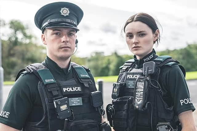 Tommy Foster (Nathan Braniff) and Annie Conlon (Katherine Devlin) are coppers patrolling the Belfast beat in Blue Lights (Picture: Two Cities Television/Christopher Barr/BBC)