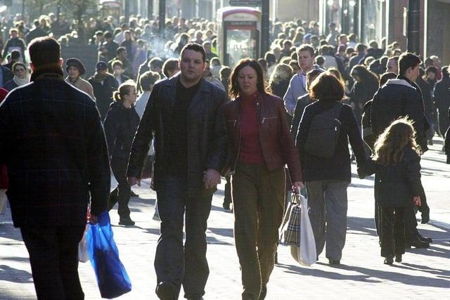 Love and shopping hand in hand. A busy Briggate for the Christmas sales in December 2000.