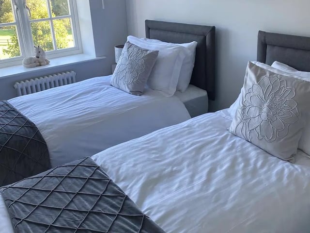 The two beds in this room provide extra space for guests.