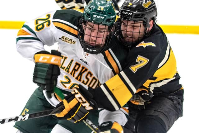 BATTLE READY: Grant Cooper, pictured battling for puck possession during his time with Clarkson University before he turned pro with Reading Royals in the ECHL. Picture courtesy of Clarkson University.
