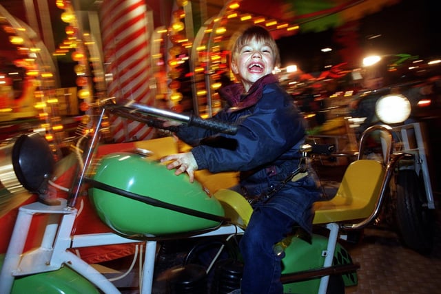 Jamie Titchmarsh has fun on one of the rides at the Valentines Fair in February 1998.