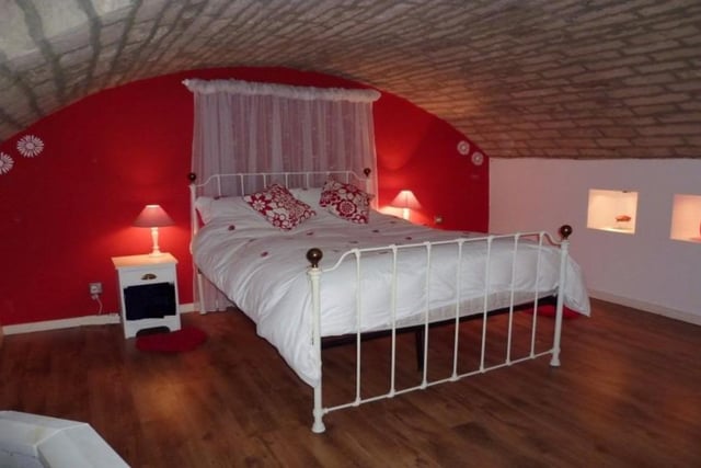 A private guest suite is on the lower ground floor, the bedroom having an arched brick roof.