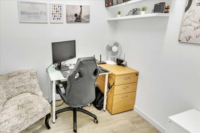 The smaller fourth bedroom is currently used as a home office space.