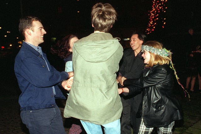 Revellers see the New Year at City Square in 1998.