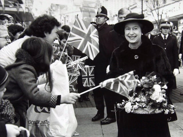 Enthusiastic crowds lean forward to greet the Queen during her visit to the Wakefield pedestrian precinct in November 1982.