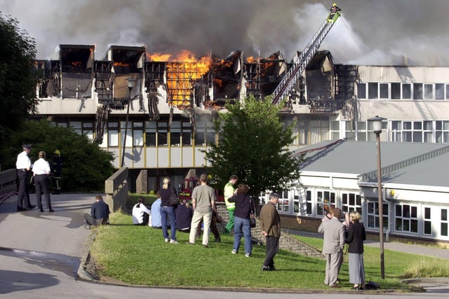 Staff watching on as firefighters tackle the blaze at Crawshaw School, Robin Lane, Pudsey, on July 13, 2001.
