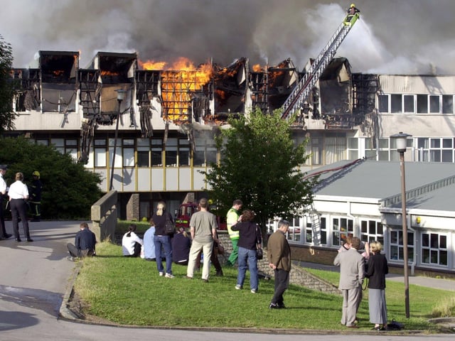 Staff watching on as firefighters tackle the blaze at Crawshaw School, Robin Lane, Pudsey, on July 13, 2001.