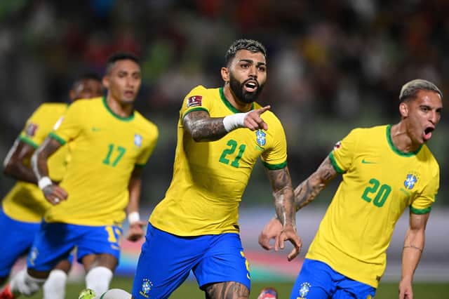 TOPSHOT - Brazil's Gabriel Barbosa (C) celebrates after scoring against Venezuela during the South American qualification football match for the FIFA World Cup Qatar 2022 at the UCV Olympic Stadium in Caracas on October 7, 2021. (Photo by YURI CORTEZ / AFP) (Photo by YURI CORTEZ/AFP via Getty Images)