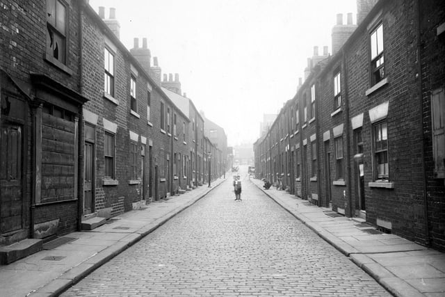 Mainly derelict houses where two children can be seen posing in the middle of the cobbled Concord Street in August 1935. The photograph was probably taken shortly before demolition of these back-to-back properties was due to commence.