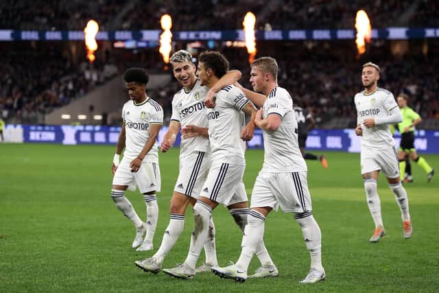 SPOT ON: Rodrigo, centre, celebrates netting his ice-cool penalty in Friday's 1-1 draw against Crystal Palace in Perth with his Whites team mates.
Photo by Will Russell/Getty Images.