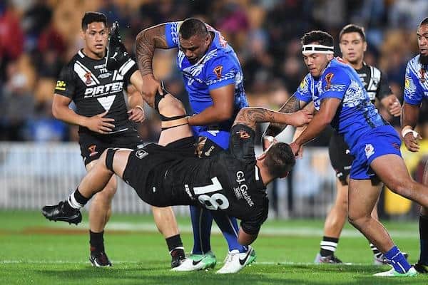 Sam Lisone, playing for Samoa, tackles New Zealand's Jared Waerea-Hargreaves durng the 2017 World Cup. Picture by Andrew Cornaga/SWpix.com/PhotosportNZ.