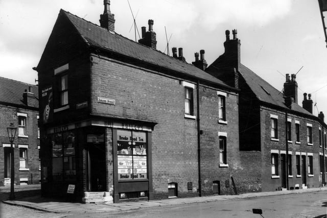 A view from Bleasby Street to Askern Street in June 1964. On the left edge is Askern Place. The grocers shop, Baileys, is number 11 Askern Street, it has been extended back and is two properties combined. Moving right, numbers 13 and 15 can be seen.
