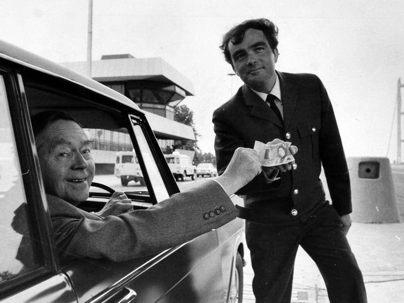 Councillor Alex Clarke pays his £1 to the toll booth operator John Mackinder at the opening in June 1981.