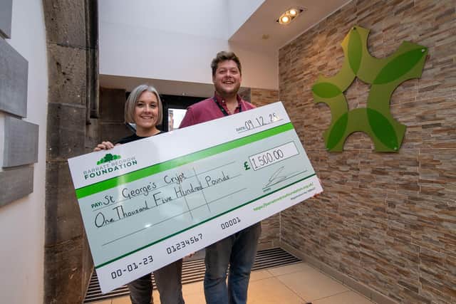 B&DWYW - 6 - Erica from Barratt and David Wilson Homes presenting a cheque to Richard from the charity