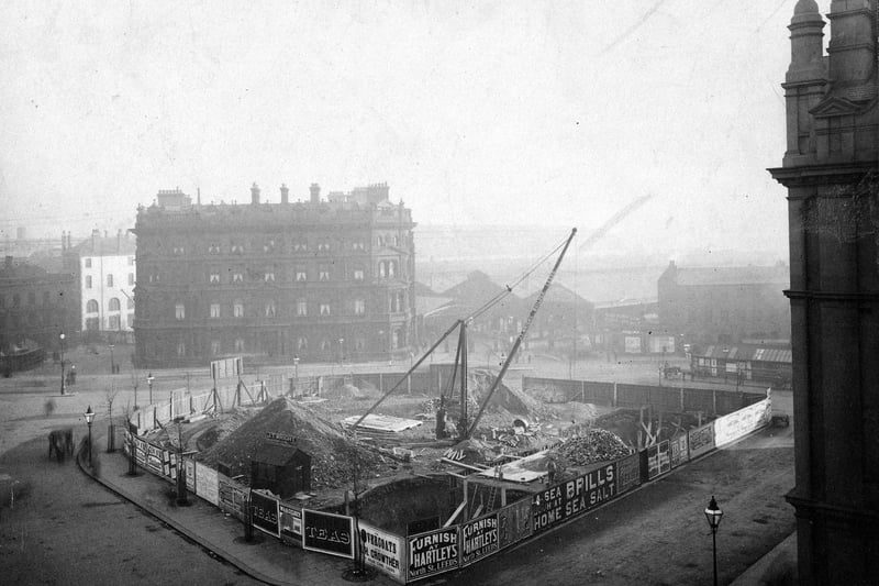 The construction of City Square in April 1897. Leeds was given the status of City by Queen Victoria in 1893, it was then decided to build the square. The site had formerly been occupied by the Coloured Cloth Hall and Quebec House. Bishopgate Street is on the left and the entrance to the station on the right.