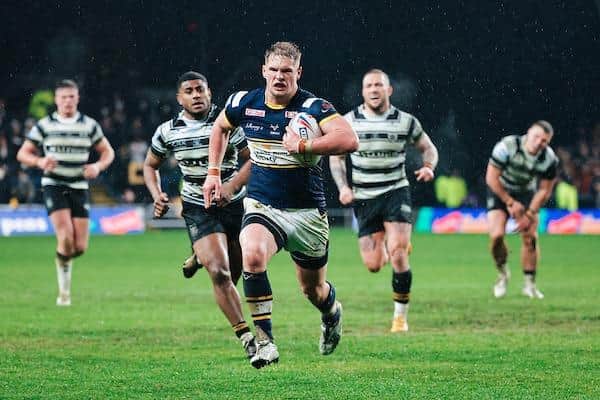 Substitute Tom Holroyd powers away to score in Rhinos' win over Hull. Picture by Alex Whitehead/SWpix.com.