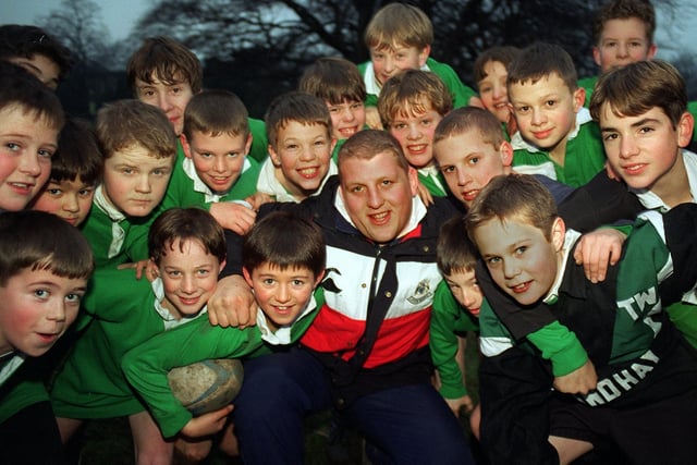 Leeds Rugby Union player Mike Shelley held at coaching session with pupils at Roundhay School in January 1997.