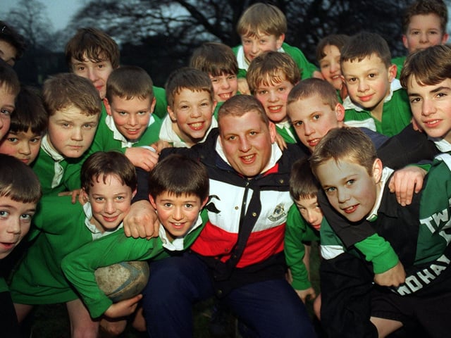 Leeds Rugby Union player Mike Shelley held at coaching session with pupils at Roundhay School in January 1997.