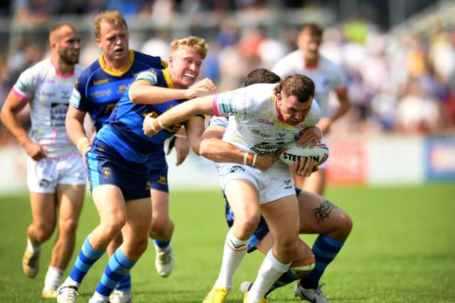 Rhinos' Cameron Smith is tackled. Picture by Simon Hulme.