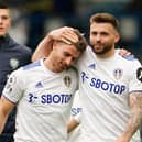 Leeds United's Northern Irish midfielder Stuart Dallas (R) and Leeds United's Swiss defender Gaetano Berardi (L) on the pitch after the English Premier League football match between Leeds United and West Bromwich Albion at Elland Road (Photo by JON SUPER/POOL/AFP via Getty Images)