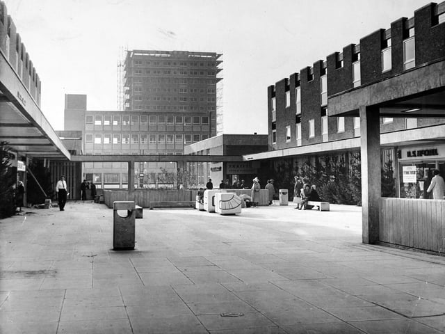 The upper precinct of Seacroft Shopping Centre in October 1965 with a 17 storey block of flats in the background.
