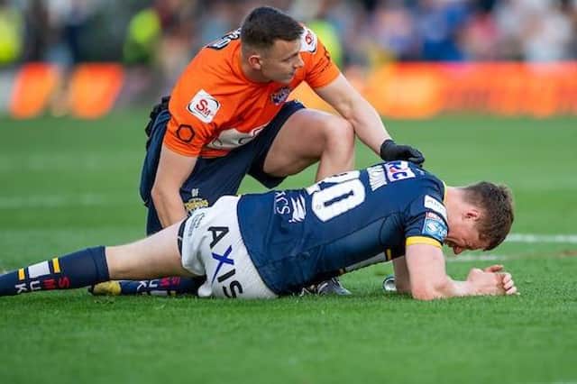 Rhinos' Morgan Gannon receives medical attention during a game. The RFL want to reduce the number of lower limb injuries next year. Picture by Allan McKenzie/SWpix.com.