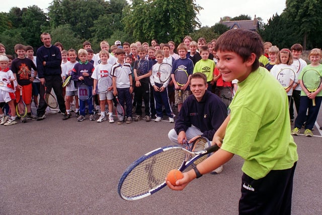 Young  Adam Lesiak is pictured being coached at a tennis camp held at courts on Old Park Road in August 1999.