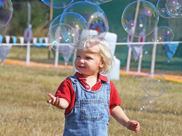 One-year-old Casper Morrison enjoys the bubbles from Memorabubble at Harrogate Food and Drink Festival at Ripley Castle (Picture Gerard Binks)