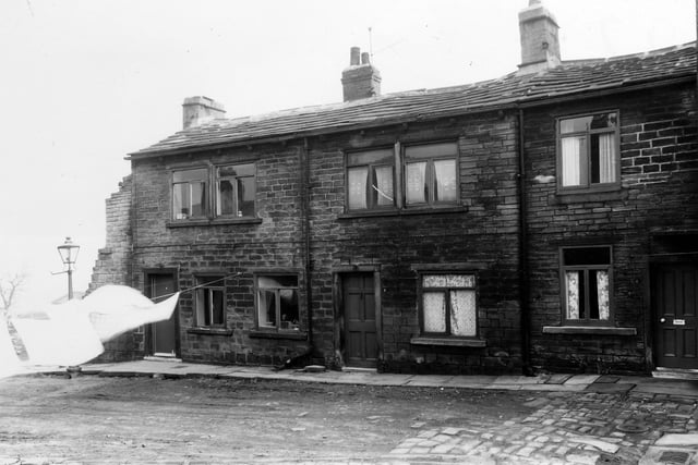 A partially demolished row of stone terraced cottages in Spetch Yard in March 1960. It was one of several old yards situated off Lower Town Street and demolished in the 1960s.