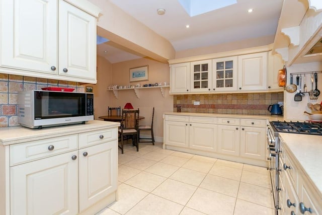The well equipped breakfast kitchen has extensive units and a range cooker.