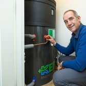 Simon Pickard with the indoor heat pump system